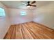 Spacious bedroom featuring updated flooring, ceiling fan, and updated lighting at 1373 Fairfax Rd, Clearwater, FL 33764