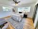 Cozy bedroom with wood floors, area rug, and natural light at 1373 Fairfax Rd, Clearwater, FL 33764
