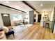 Comfortable living room featuring hardwood flooring, modern decor, and an open floor plan at 1373 Fairfax Rd, Clearwater, FL 33764