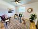Bright office with a ceiling fan, natural light, a modern rug, and contemporary furniture at 1373 Fairfax Rd, Clearwater, FL 33764