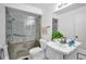 Updated bathroom with glass shower door and modern fixtures at 1400 Tarpon Woods Blvd # A4, Palm Harbor, FL 34685