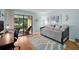 Cozy bedroom with sliding glass doors to an enclosed lanai and backyard at 1400 Tarpon Woods Blvd # A4, Palm Harbor, FL 34685
