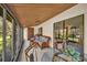 Inviting sunroom with floral furniture and a view to greenery at 1400 Tarpon Woods Blvd # A4, Palm Harbor, FL 34685