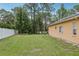 Spacious backyard with a white privacy fence and mature trees providing ample shade and privacy at 14494 Copeland Way, Brooksville, FL 34604