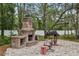 Backyard with brick fireplace, grill and outdoor seating at 14494 Copeland Way, Brooksville, FL 34604