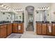 Bathroom featuring dual vanities, a soaking tub and an arched doorway to bedroom at 14494 Copeland Way, Brooksville, FL 34604