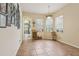 Bright dining room with tile floors, wine rack, and plenty of natural light at 14494 Copeland Way, Brooksville, FL 34604