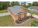 Well-maintained single Gathering home with mature trees, solar panels, privacy fence, and manicured flower beds at 14494 Copeland Way, Brooksville, FL 34604