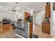 Open concept kitchen with granite countertops, stainless steel appliances, and an adjacent dining area at 14494 Copeland Way, Brooksville, FL 34604
