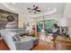 Bright living room with wood floors, stylish furniture, and views of the screened patio at 14494 Copeland Way, Brooksville, FL 34604