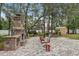 Outdoor patio features a brick fireplace, seating area, grill, and storage shed at 14494 Copeland Way, Brooksville, FL 34604