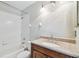 Bathroom featuring a vanity with stone countertop and a shower and tub combo at 16003 Ridley Pl, Tampa, FL 33647