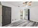 Comfortable bedroom with stylish gray flooring, ceiling fan, and a window with a view at 16003 Ridley Pl, Tampa, FL 33647