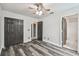 Cozy bedroom with new flooring, ceiling fan and neutral walls offering a serene retreat at 16003 Ridley Pl, Tampa, FL 33647