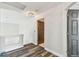 Hallway with wood-look floors, leading to doorway on the right at 16003 Ridley Pl, Tampa, FL 33647