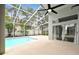 Inviting pool area with a large screened lanai, perfect for relaxing and enjoying the outdoors at 16003 Ridley Pl, Tampa, FL 33647