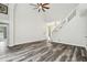 Bright and airy living room features soaring ceilings and an open staircase to the upper level at 16003 Ridley Pl, Tampa, FL 33647
