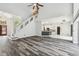 Open-concept living area featuring soaring ceilings, a staircase, and flows into the kitchen at 16003 Ridley Pl, Tampa, FL 33647