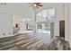 Spacious living room boasts vaulted ceilings and views of the pool and the kitchen area at 16003 Ridley Pl, Tampa, FL 33647