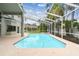 Exterior view of screened-in pool and patio at 16003 Ridley Pl, Tampa, FL 33647