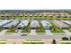 Stunning aerial view of modern single-Gathering homes with well-manicured lawns at 16126 San Donato Pl, Bradenton, FL 34211