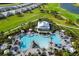 Breathtaking aerial view of a pool, golf course, and luxury homes in a gated community at 16126 San Donato Pl, Bradenton, FL 34211