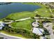 Scenic aerial view of a golf course, lush landscaping, and putting greens at 16126 San Donato Pl, Bradenton, FL 34211