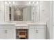 Bright bathroom with double vanity, framed mirror, and a view into the shower at 16126 San Donato Pl, Bradenton, FL 34211
