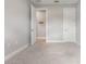 Neutral bedroom with carpeted floors and walk-in closet, providing a blank canvas for personalization at 16126 San Donato Pl, Bradenton, FL 34211