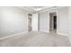 Bright bedroom with plush carpet, tray ceiling, and convenient access to an adjacent bathroom and a walk-in closet at 16126 San Donato Pl, Bradenton, FL 34211
