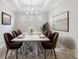 Elegant dining room featuring a modern chandelier and stylish decor at 16126 San Donato Pl, Bradenton, FL 34211