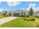 Charming single-story home with lush landscaping and a two-car garage at 16126 San Donato Pl, Bradenton, FL 34211