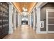 Elegant hallway with barrel ceiling, locker storage, and decorative sconces at 16126 San Donato Pl, Bradenton, FL 34211