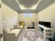 Cozy living room featuring recessed lighting, two sofas, and a treadmill for convenient home workouts at 16126 San Donato Pl, Bradenton, FL 34211