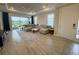 Large living room featuring a comfortable seating arrangement and access to the outdoor patio at 16126 San Donato Pl, Bradenton, FL 34211
