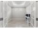 Bright office space with tiled floor, tray ceiling, double glass doors, and a well-lit workstation for productivity at 16126 San Donato Pl, Bradenton, FL 34211