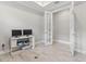 Bright office with desk, double french doors, and wood-look tile flooring at 16126 San Donato Pl, Bradenton, FL 34211