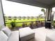 Relaxing screened-in patio with comfortable seating and a picturesque lake view at 16126 San Donato Pl, Bradenton, FL 34211