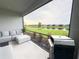 Enjoy a backyard view from this screened-in patio with seating and a grill at 16126 San Donato Pl, Bradenton, FL 34211