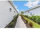 Well-maintained side yard with a paver walkway, offering a private and landscaped pathway at 16126 San Donato Pl, Bradenton, FL 34211