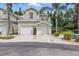 Charming two-story townhome with a two-car garage, private balcony, and well-maintained landscaping at 1827 Hammocks Ave # 1303, Lutz, FL 33549