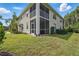 Screened lanai and second-floor balcony provide outdoor living space in this well-maintained townhome community at 1827 Hammocks Ave # 1303, Lutz, FL 33549