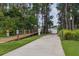 Scenic path to a dock with lush greenery, offering easy water access for relaxation and recreation at 1827 Hammocks Ave # 1303, Lutz, FL 33549