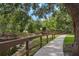 Picturesque walkway with wood bridge surrounded by water and lush greenery for peaceful strolls at 1827 Hammocks Ave # 1303, Lutz, FL 33549