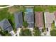 Aerial view showcases the home with a screened-in pool and a fenced yard in a neighborhood at 20109 Bay Cedar Ave, Tampa, FL 33647