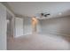 Bedroom featuring carpet, ceiling fan, neutral paint, and multiple doorways for easy access at 20109 Bay Cedar Ave, Tampa, FL 33647