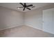 Bedroom featuring carpet, ceiling fan, neutral paint, closet, and window for natural light at 20109 Bay Cedar Ave, Tampa, FL 33647