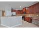 Kitchen with stainless steel appliances, granite countertops, breakfast bar, and built-in desk area at 20109 Bay Cedar Ave, Tampa, FL 33647