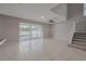 Open living space with tile floors, sliding glass doors, and access to the pool at 20109 Bay Cedar Ave, Tampa, FL 33647