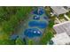 Aerial view of the community playground featuring swings, slides, and various play structures on a cushioned surface at 20109 Bay Cedar Ave, Tampa, FL 33647